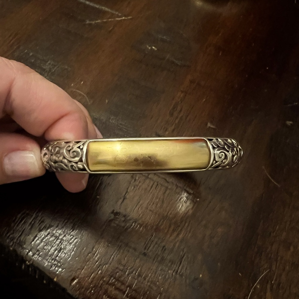 Brighton bracelet, silver and gold. Hinge closure.